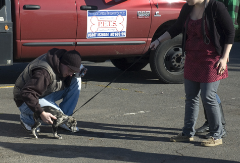 puppy with owners.jpg
